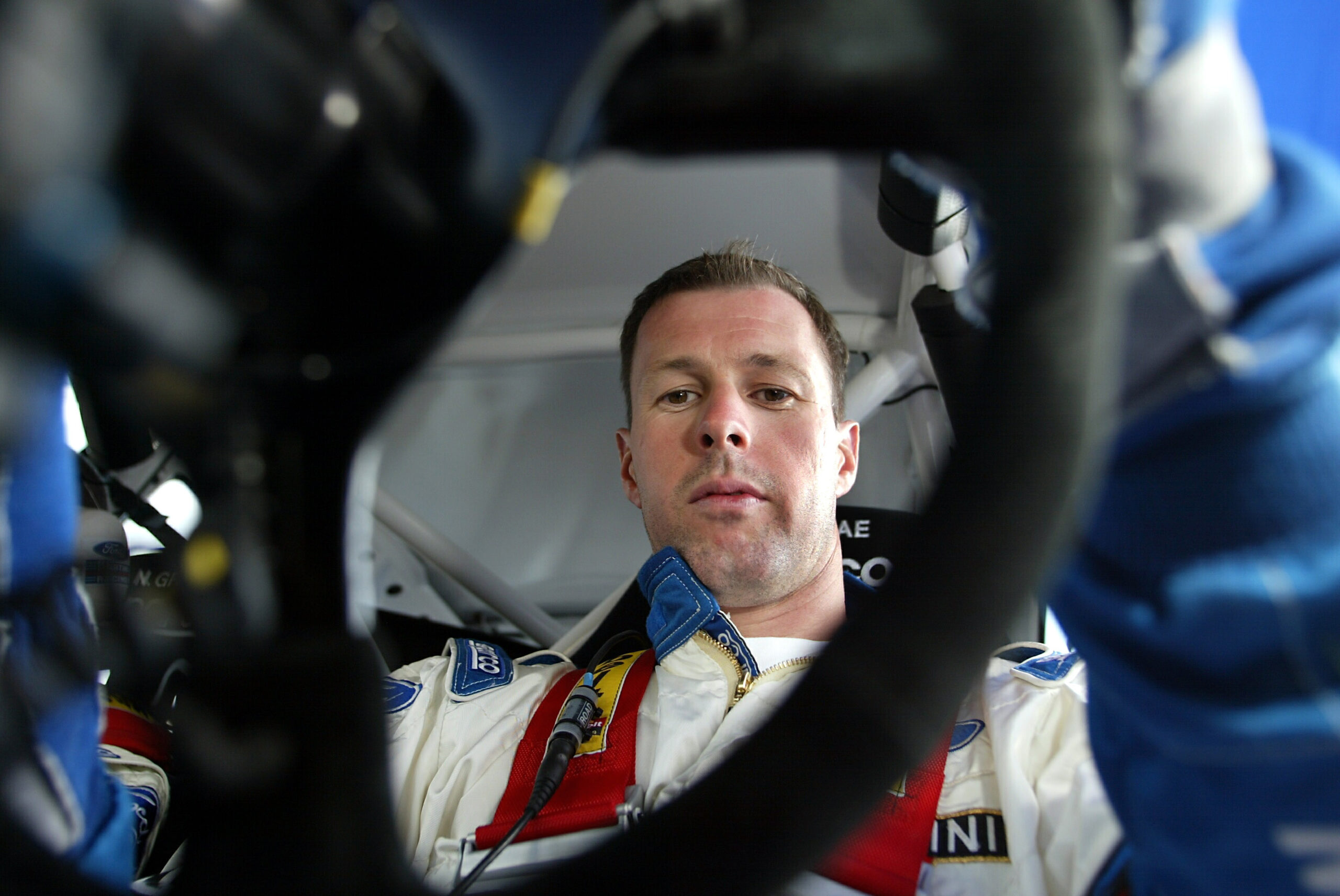 Colin McRae in a car behind the wheel